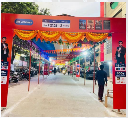 Festival activation entrance arch decorated with banners and lights