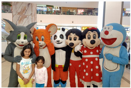 Mall activation with cartoon characters posing with kids inside a mall