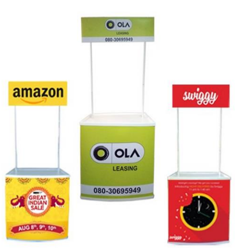 Outdoor hotspot branding with a cart and banner near trees