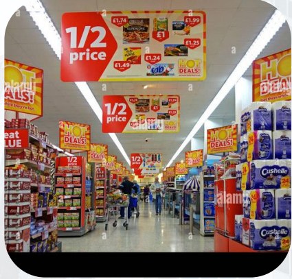 Supermarket aisle with branding and discount signs
